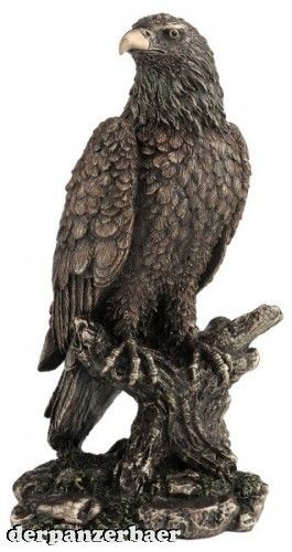 Adler auf Ast bronz./color